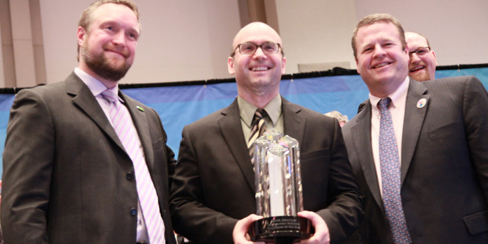 Gordon Erdelean (center) receives his Employee of the Year award from Paul Whittleston (left) and Chris Toomey, senior vice president, Coatings Solutions North America.