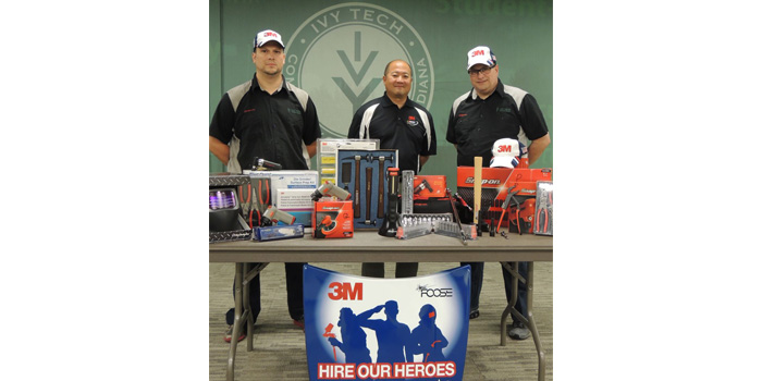 Ivy Tech Northeast automotive technology student Gabriel Davis (left) and graduate Paul Hyde (right) display $3,000 in tools and equipment that each individual selected as a recipient of the Collision Repair Education Foundation’s 3M Hire Our Heroes tool grant for 2015. Both men are joined by Randy Minobe, senior account representative with the 3M Automotive Aftermarket Division. 