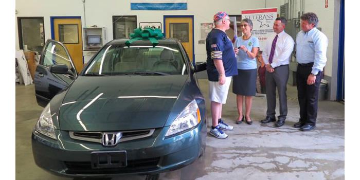 Gonzales receiving the key to his 2004 Honda Accord.