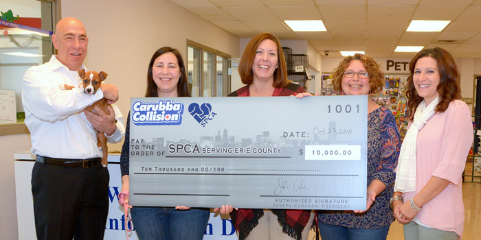 All smiles at the SPCA Serving Erie County as Carubba Collision Corp. President and CEO Joe Carubba (left), presents a $10,000 check to the SPCA. Members of the SPCA Administrative staff were on hand to accept the Carubba Collision donation.                                                                                